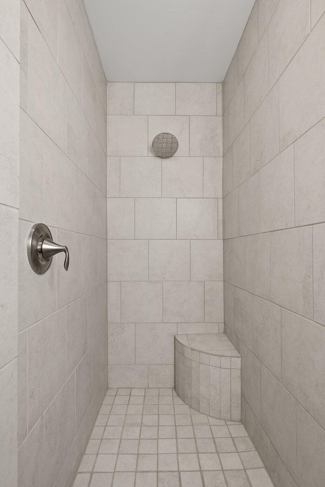 bathroom with tiled shower