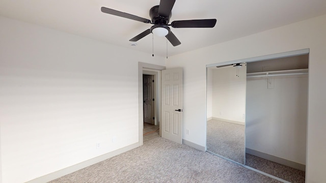 unfurnished bedroom with carpet flooring, a closet, and ceiling fan