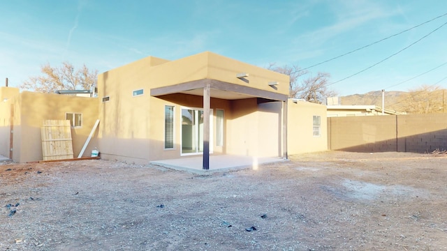 rear view of house featuring a patio