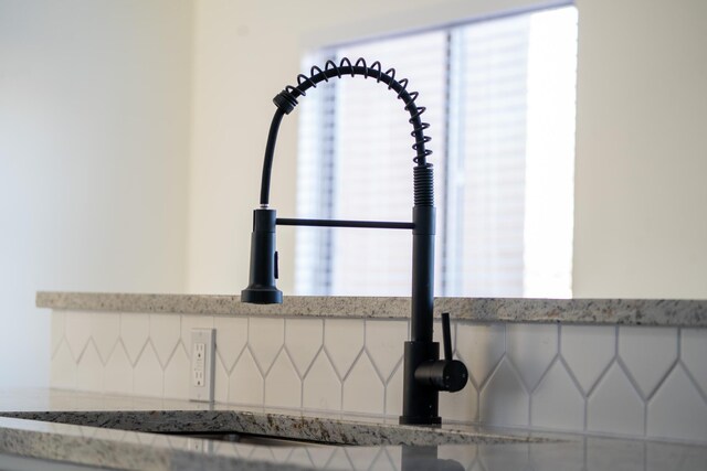 interior details with light stone counters and sink