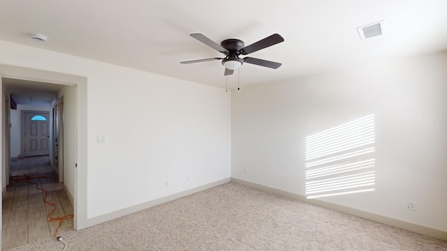 spare room with ceiling fan and hardwood / wood-style flooring