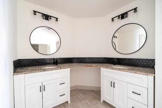 bathroom featuring hardwood / wood-style floors and vanity