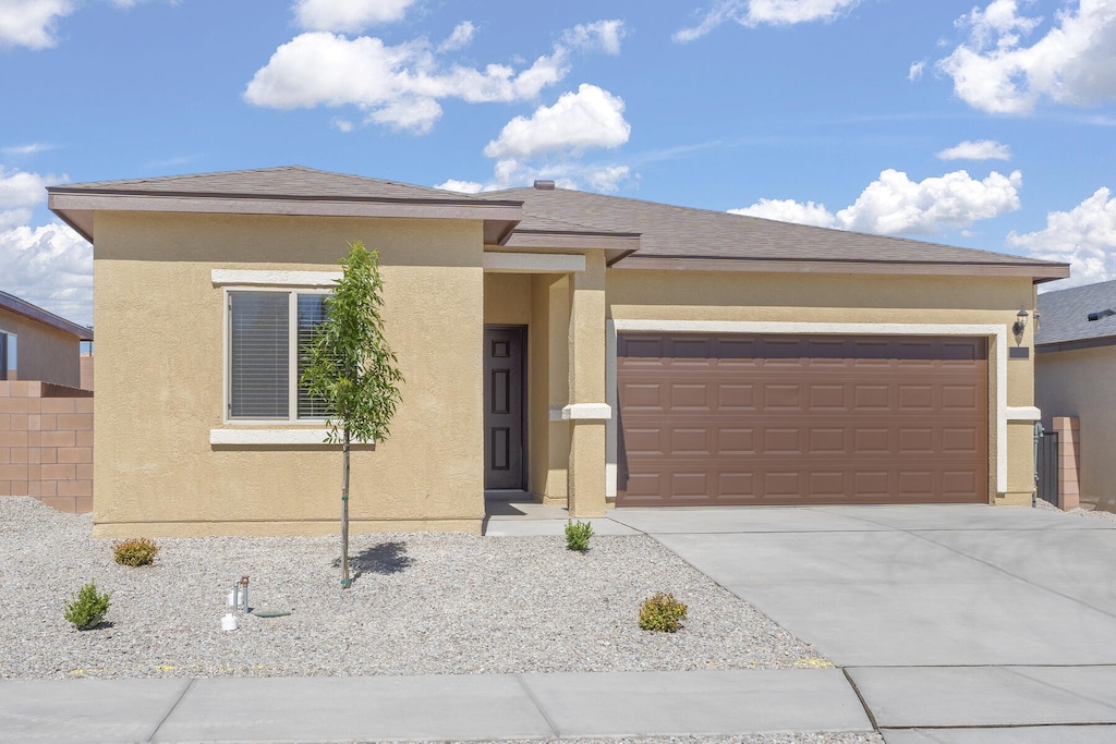 prairie-style house featuring a garage