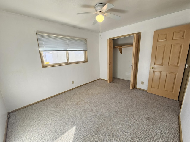 unfurnished bedroom with a closet, ceiling fan, and carpet flooring