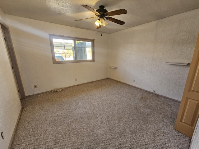 unfurnished bedroom featuring ceiling fan, light colored carpet, and a textured ceiling