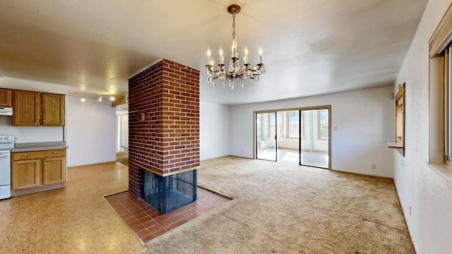 unfurnished living room with dark carpet and a fireplace