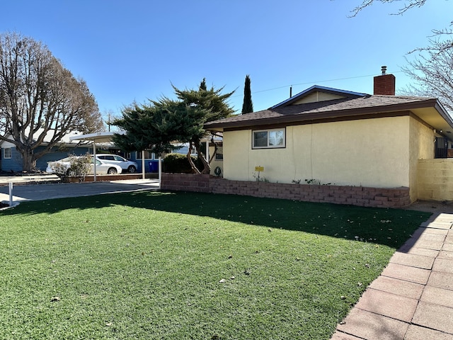 view of home's exterior with a yard