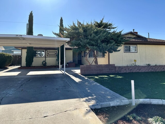 view of front facade with a carport