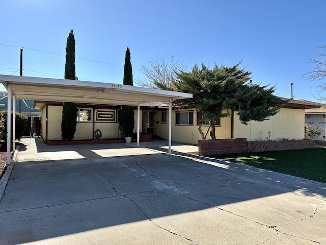 view of front of home with a carport