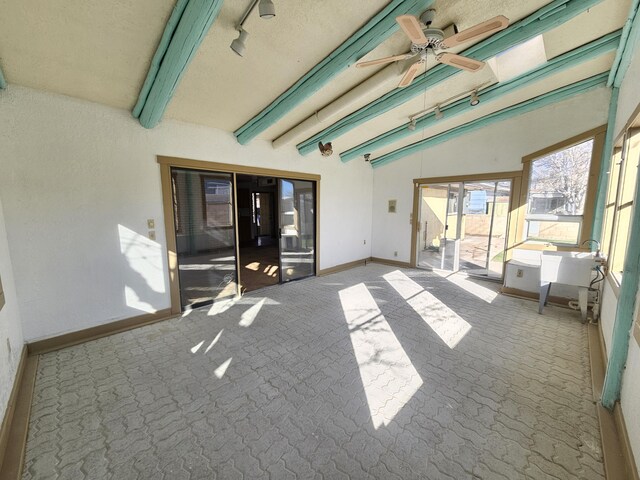 back of property with a patio, a lawn, and solar panels