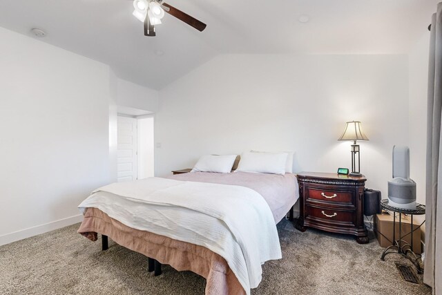 bedroom featuring ceiling fan, light colored carpet, and vaulted ceiling