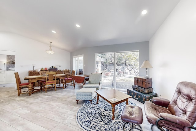 living room featuring lofted ceiling