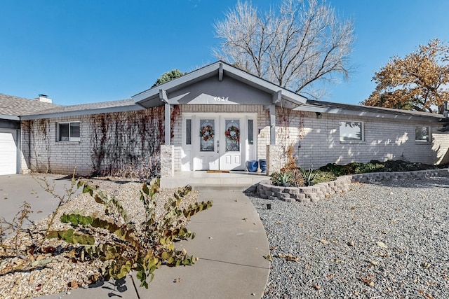 ranch-style home with a garage