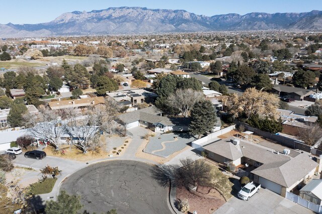 birds eye view of property with a mountain view