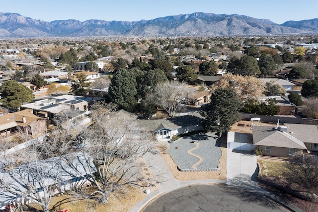 birds eye view of property with a mountain view