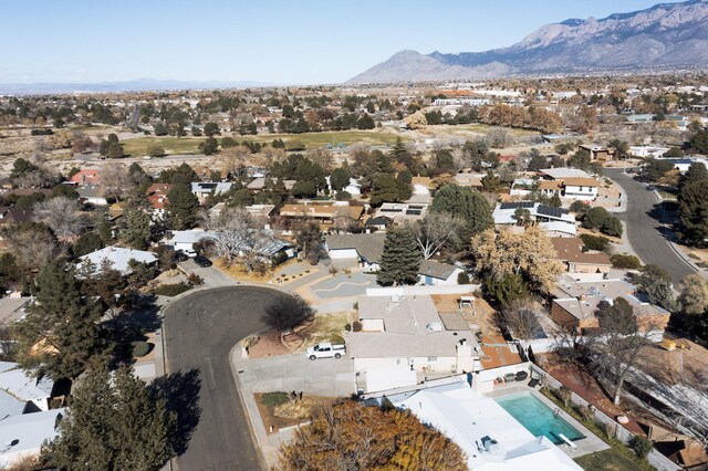 birds eye view of property featuring a mountain view