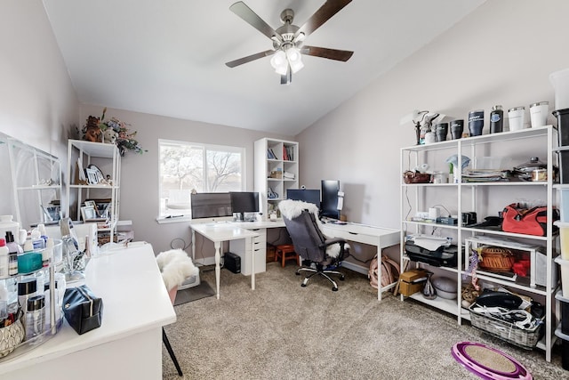 carpeted office space with ceiling fan and lofted ceiling