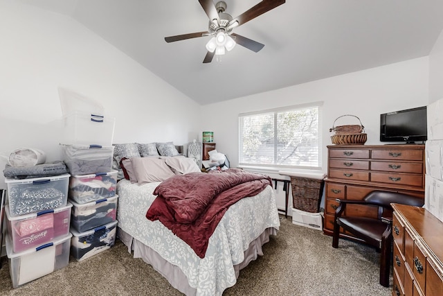 bedroom featuring vaulted ceiling, ceiling fan, and carpet