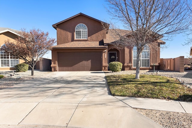 view of front of property featuring a front yard and a garage