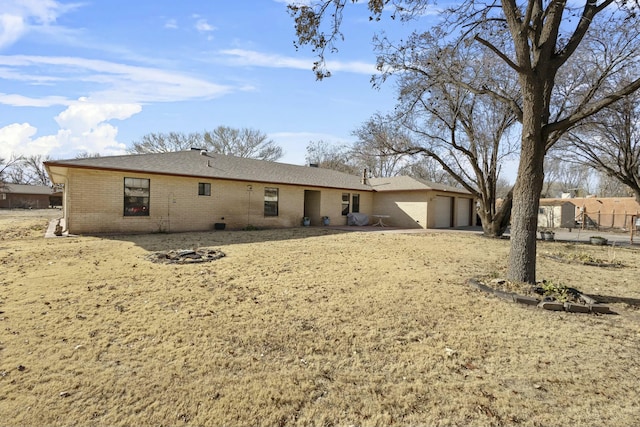 back of house with a garage