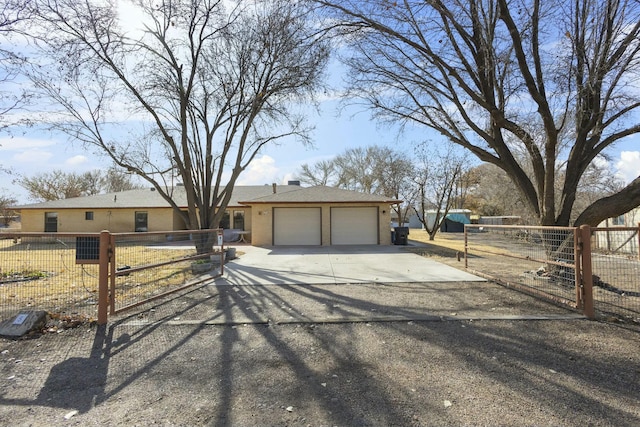 ranch-style house featuring a garage