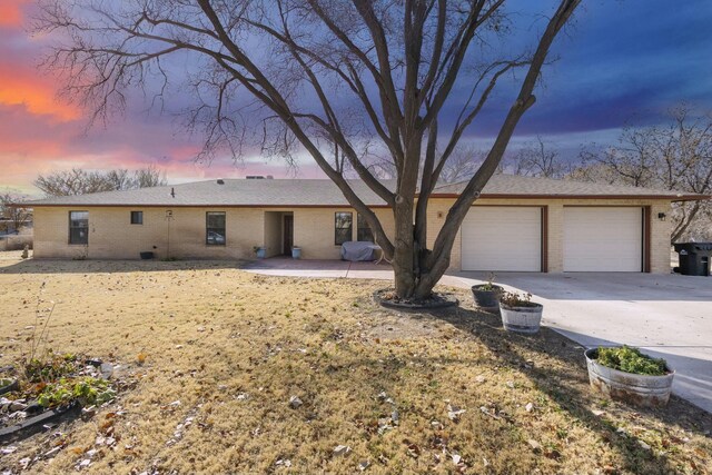 ranch-style house featuring a garage