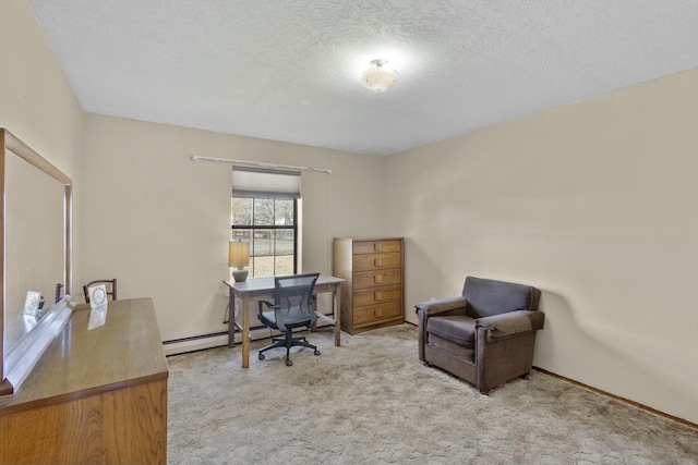 carpeted office with baseboard heating and a textured ceiling