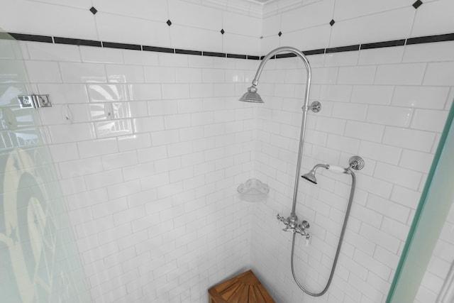 bathroom with a tile shower