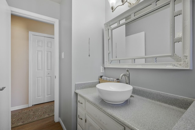 bathroom with vanity and hardwood / wood-style flooring