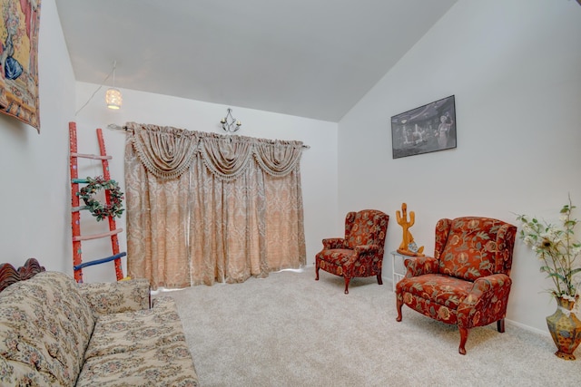 living area with carpet flooring and lofted ceiling