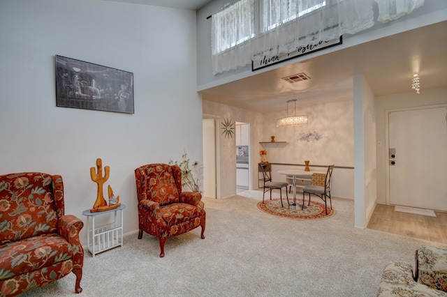 sitting room with carpet floors