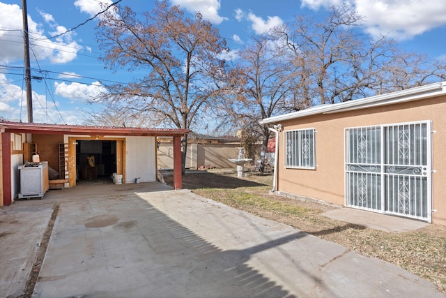 view of home's exterior featuring an outbuilding