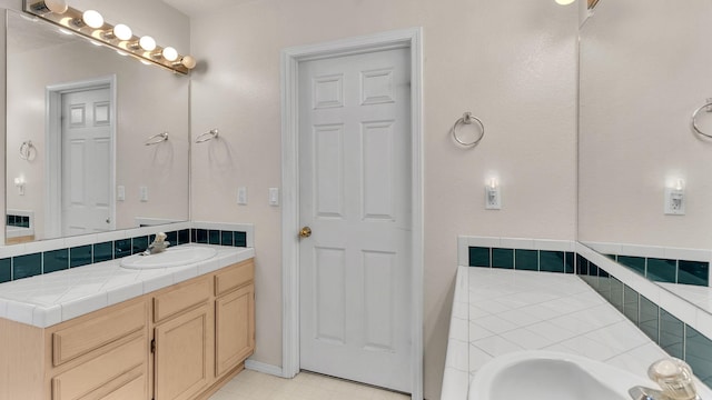 bathroom with vanity and tile patterned floors