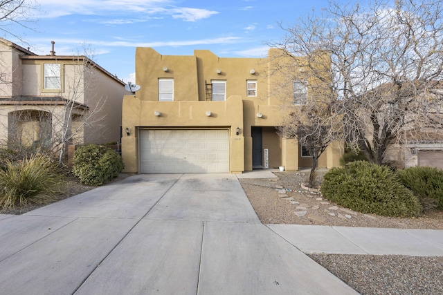 adobe home featuring a garage