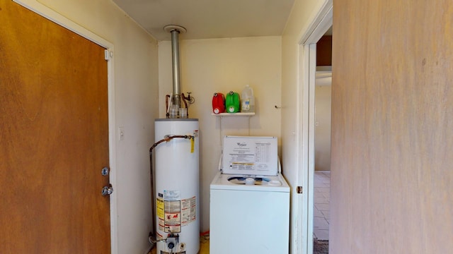 utilities with gas water heater and washer / dryer