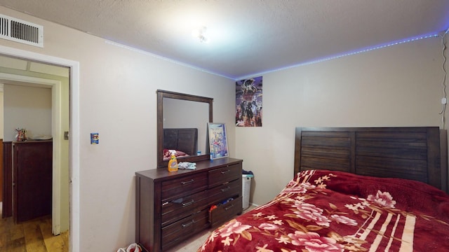 bedroom with light wood-type flooring