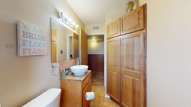 bathroom with tile patterned floors, vanity, and toilet