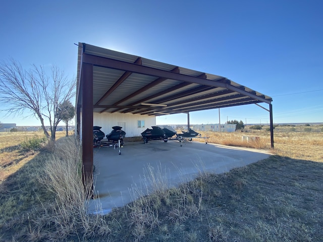 view of parking / parking lot featuring a carport