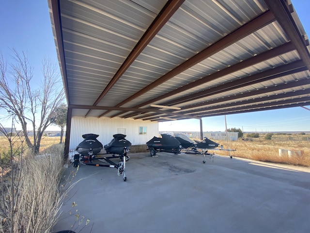 view of vehicle parking featuring a carport