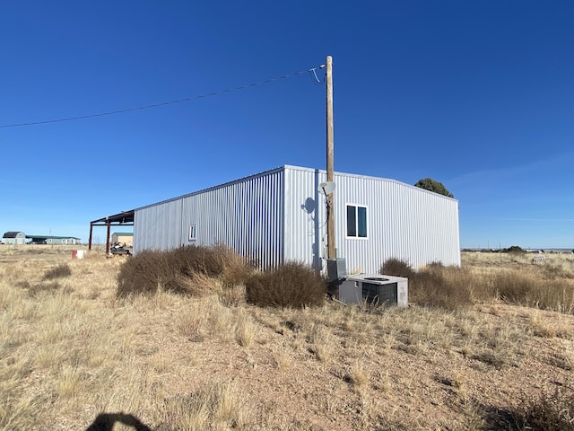 view of outdoor structure featuring central AC unit