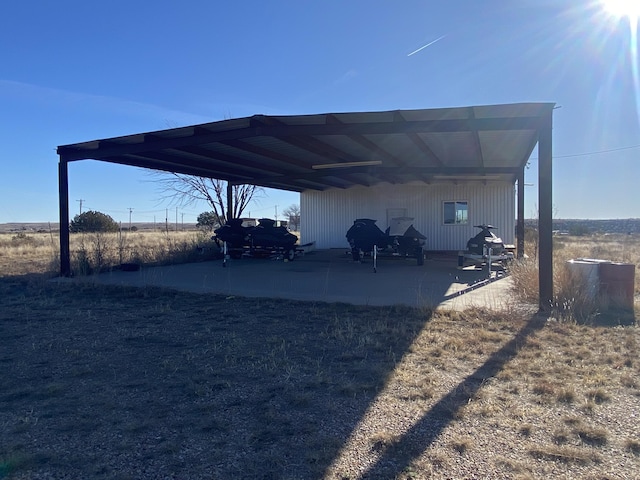 view of vehicle parking featuring a carport