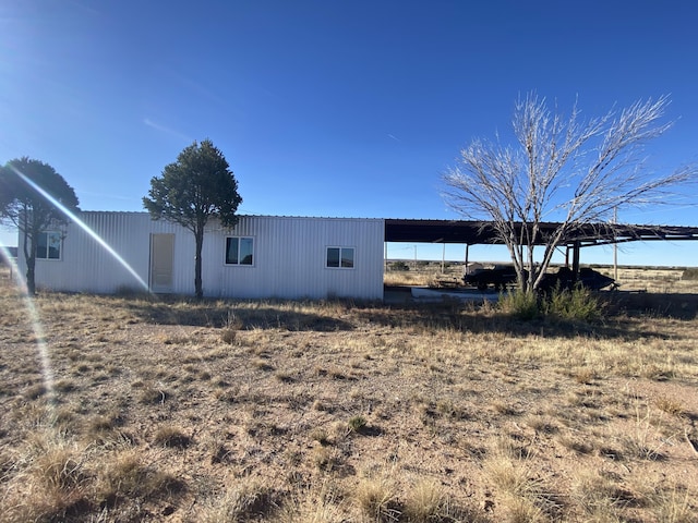 view of side of property featuring a carport