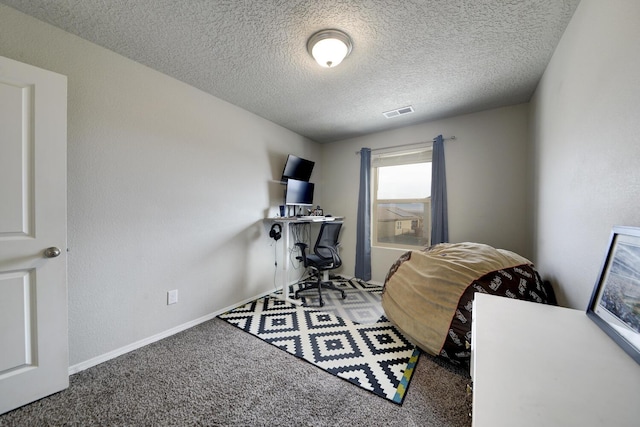 misc room featuring carpet floors and a textured ceiling