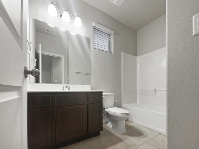 full bathroom with tile patterned floors, vanity, a textured ceiling, shower / bathing tub combination, and toilet