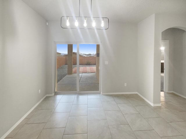 unfurnished dining area featuring light tile patterned floors