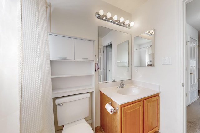 bathroom with vanity and toilet