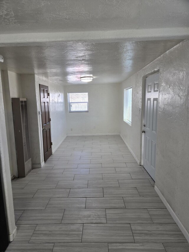 foyer entrance featuring a textured ceiling