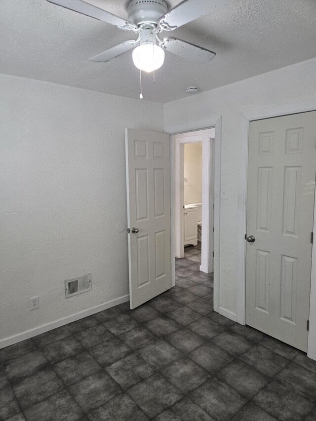 interior space featuring ceiling fan