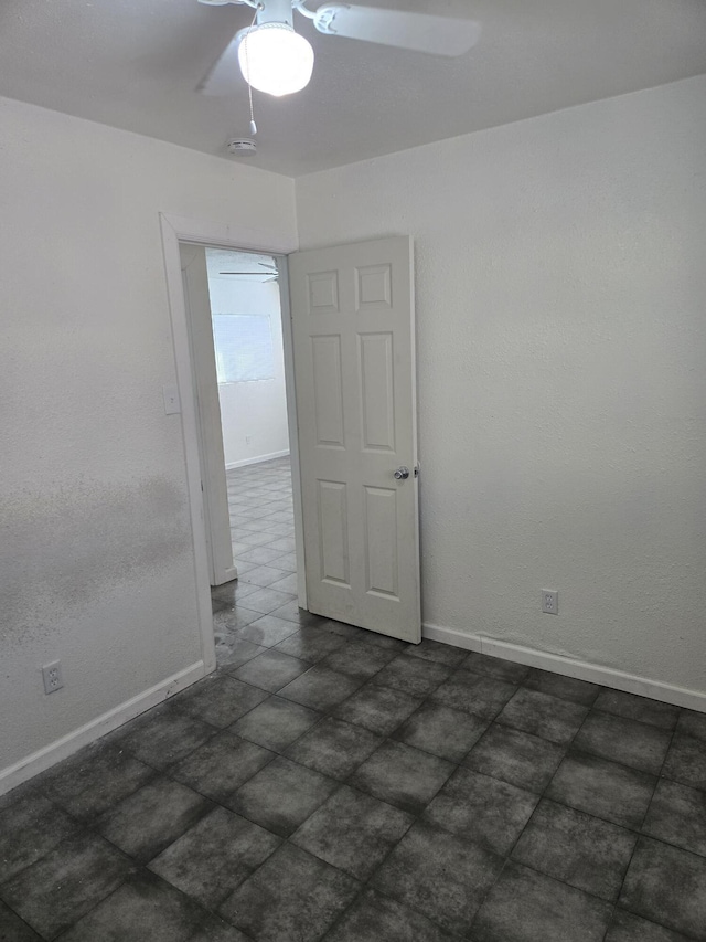 spare room with ceiling fan