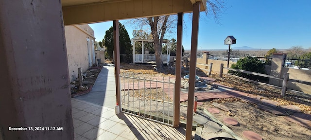 view of patio / terrace featuring a mountain view